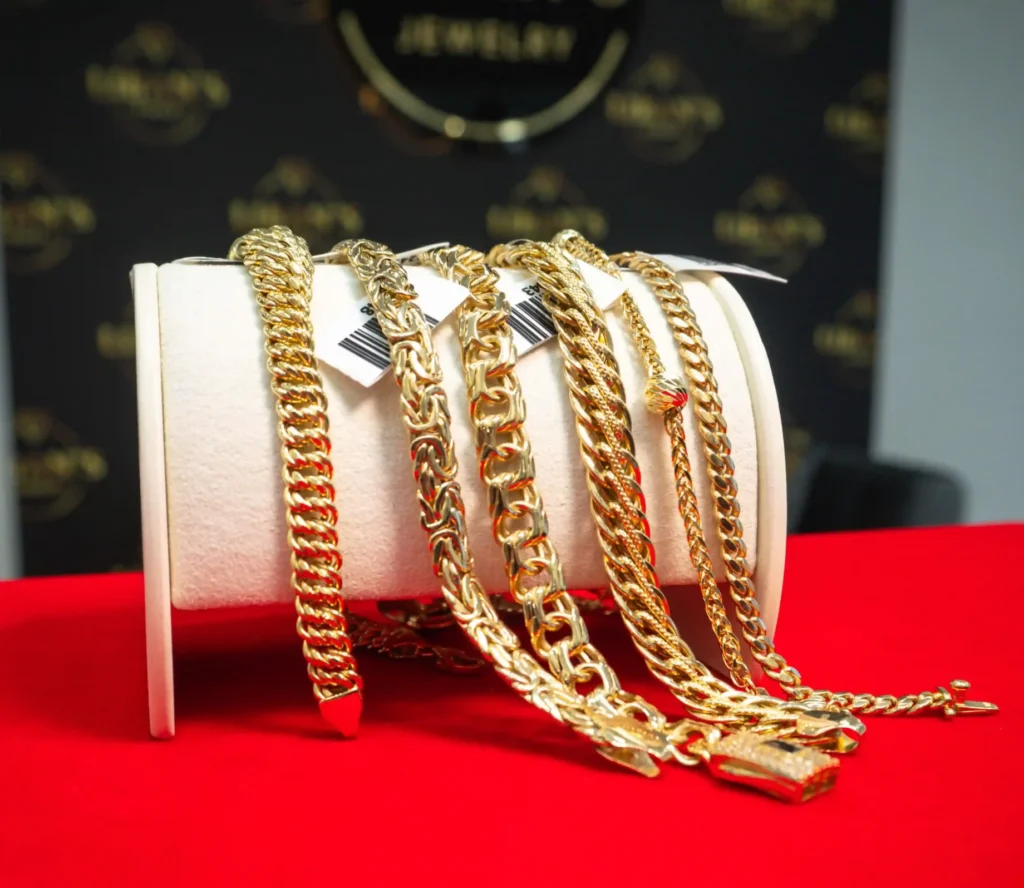 Gold bracelet collection displayed at a jewelry store in Cape Coral